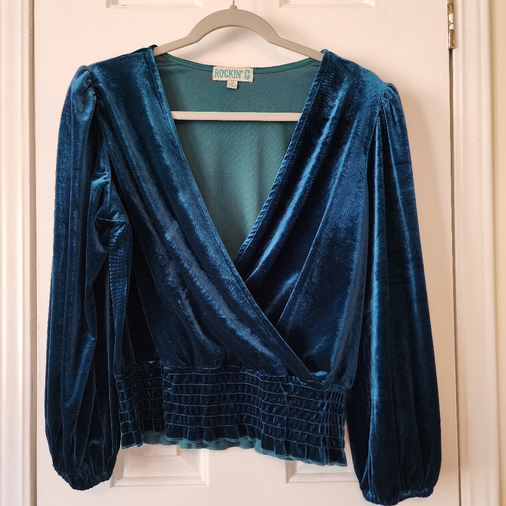 Dark green/teal top.  Stretchy velvet type fabric.   Size Medium.